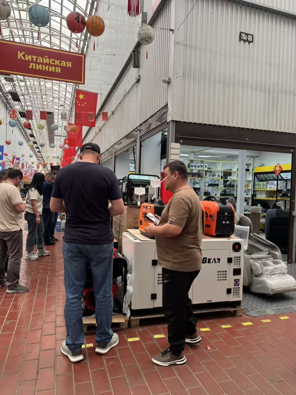 Open-frame and enclosed portable generators shown at a Chinese goods retail line in Russia